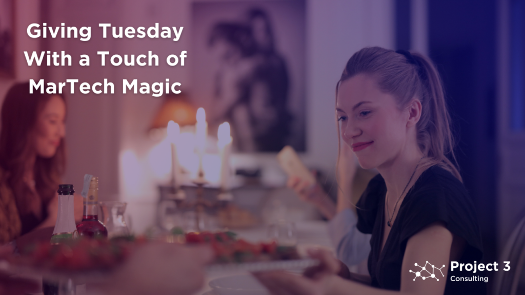 Photo of a woman at a holiday dinner, smiling while considering what charitable donations she will make on Giving Tuesday
